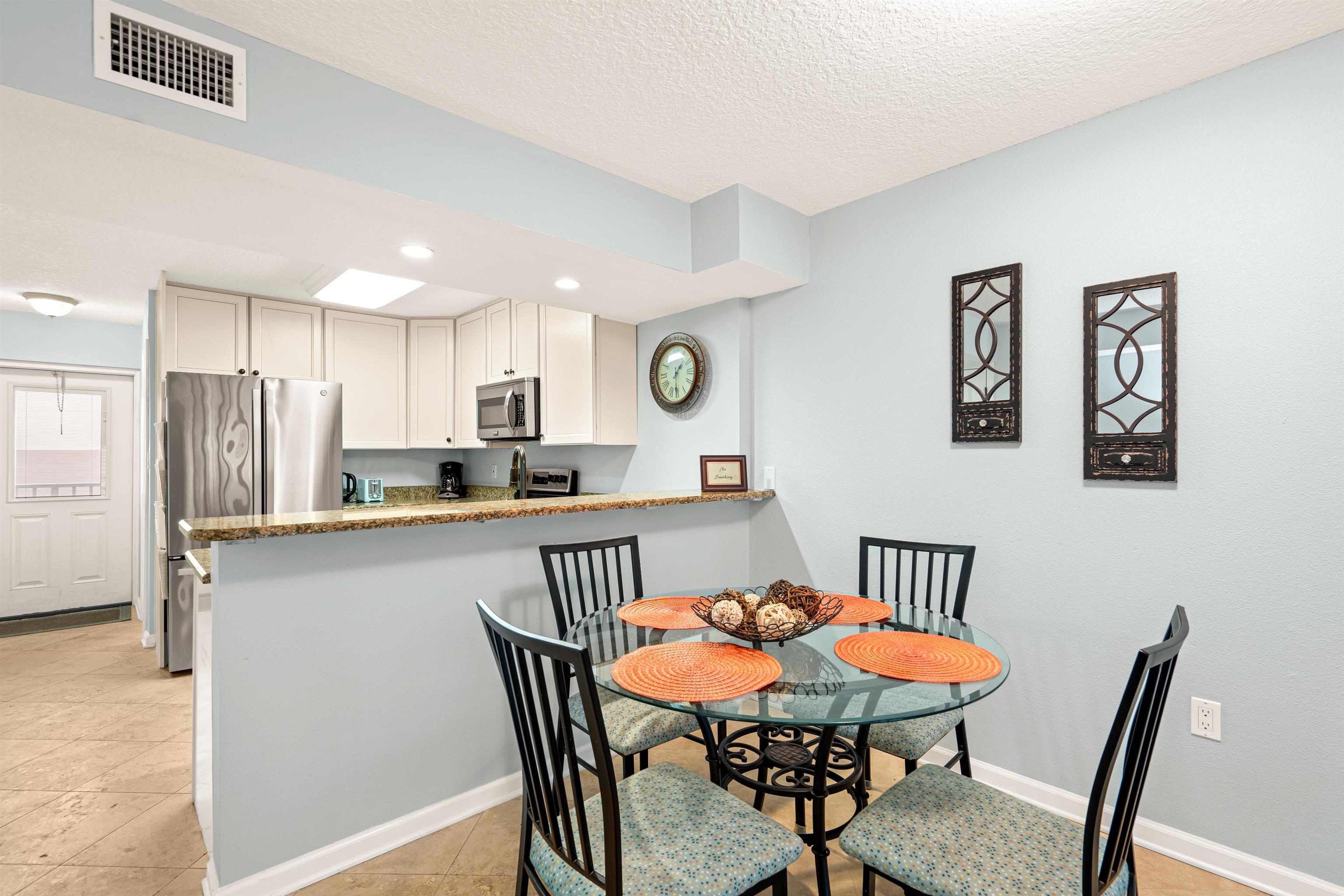 1 Ocean Trace Road, Unit 232 St. Augustine, FL 32080 - Photo 6 of 49 a view of a dining room with furniture