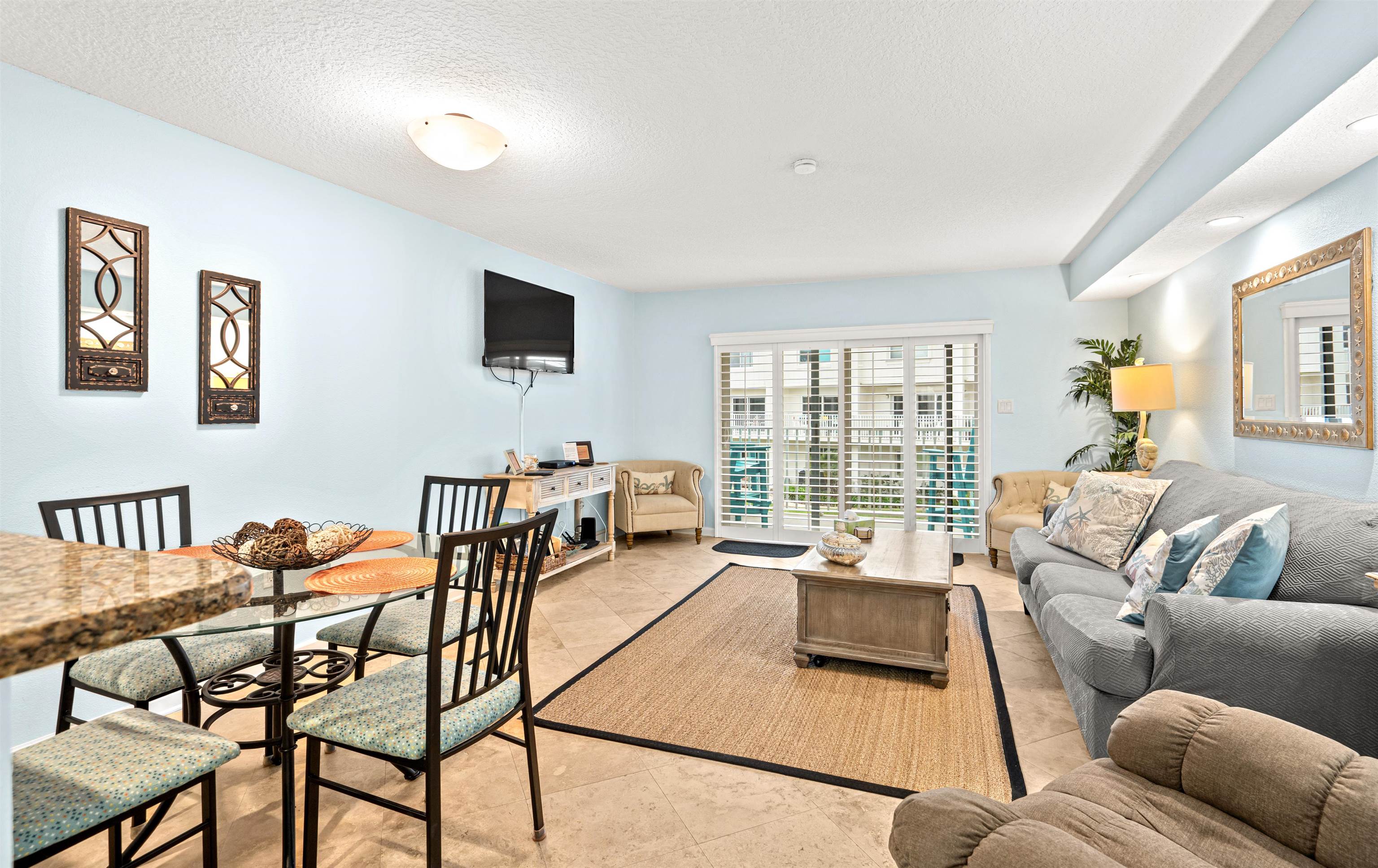 1 Ocean Trace Road, Unit 232 St. Augustine, FL 32080 - Photo 7 of 49 a living room with furniture and a flat screen tv