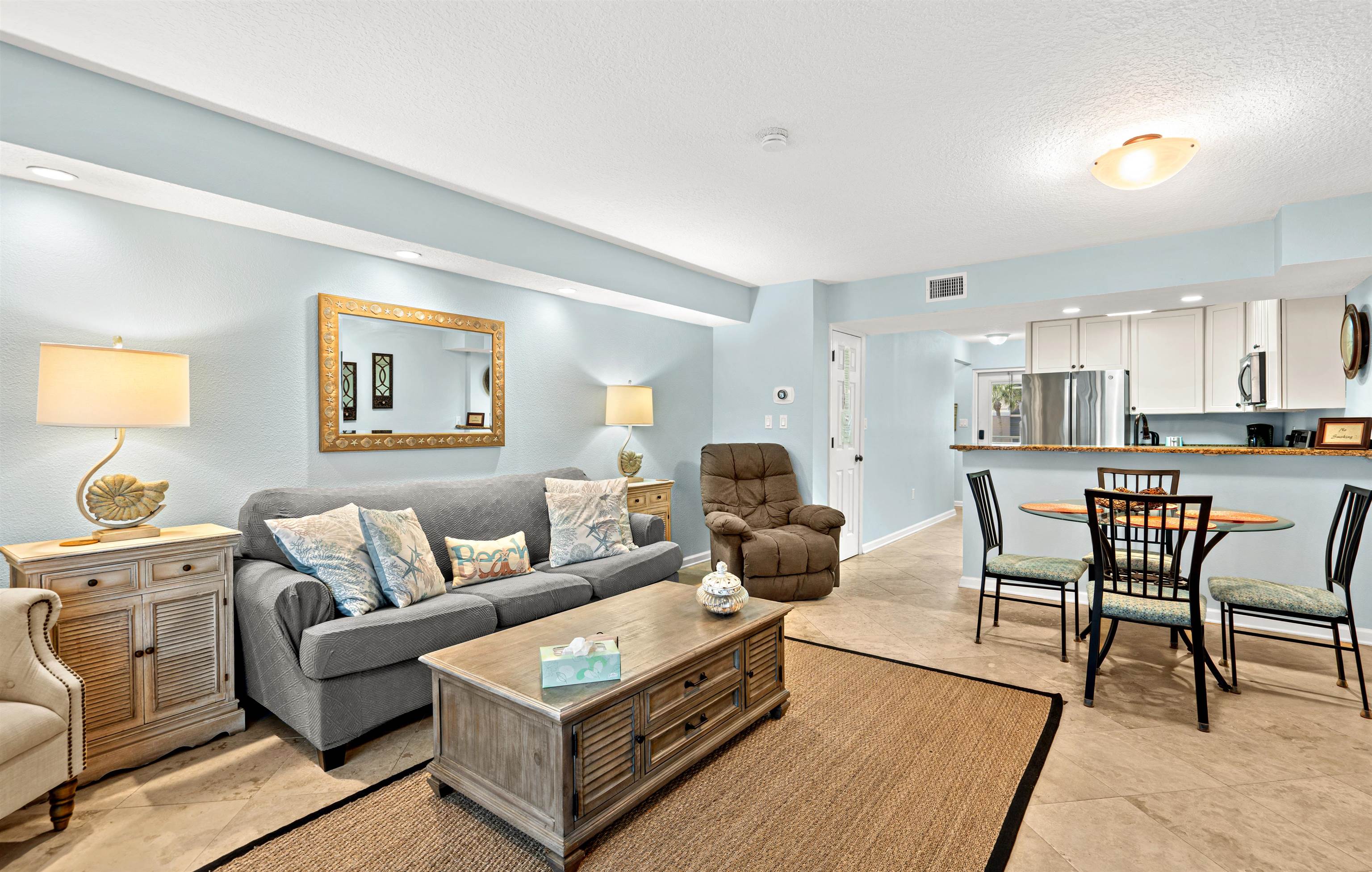 1 Ocean Trace Road, Unit 232 St. Augustine, FL 32080 - Photo 9 of 49 a living room with furniture and a wooden floor