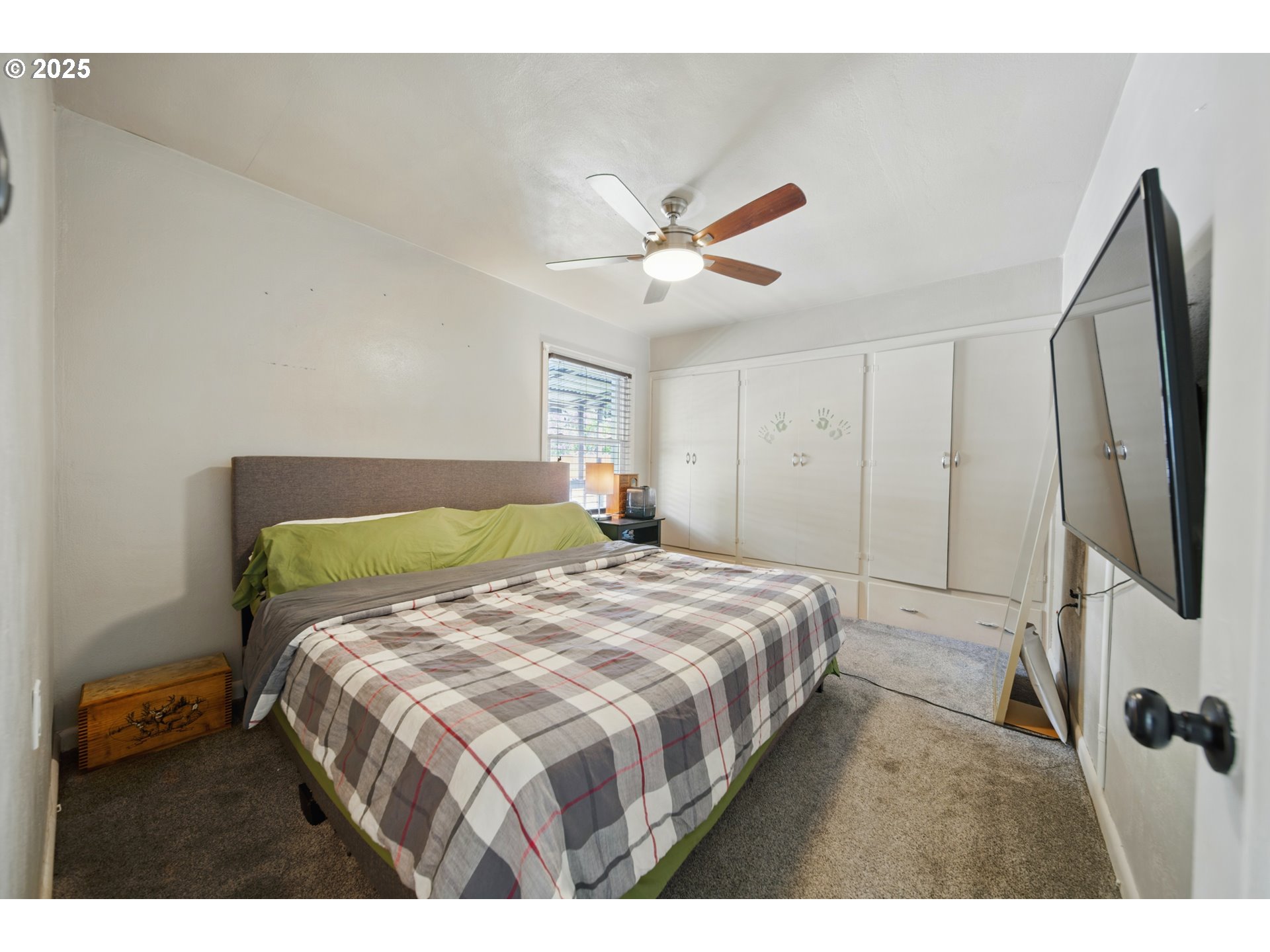 1317 Chestnut Street Milton Freewater, OR 97862 - Photo 10 of 23 a bedroom with a bed and a chandelier