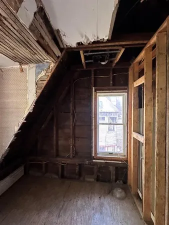 a view of entryway with wooden floor and furniture