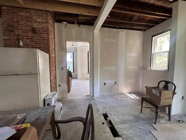 a view of a livingroom with furniture and windows