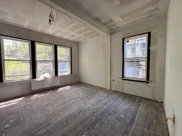 a view of an empty room with a window