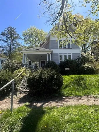 a view of workspace with furniture and windows