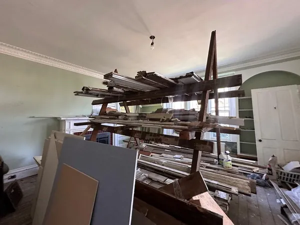 a living room with furniture window and wooden floor