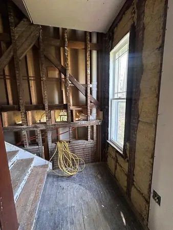 a view of a living room and entry way