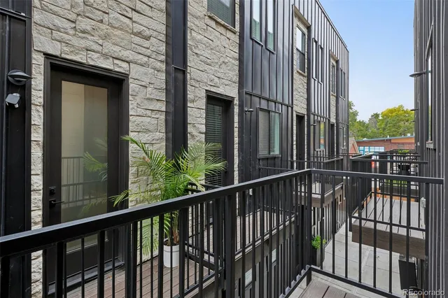 a view of a balcony with a floor to ceiling window
