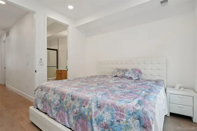 a bedroom with a bed and a couch