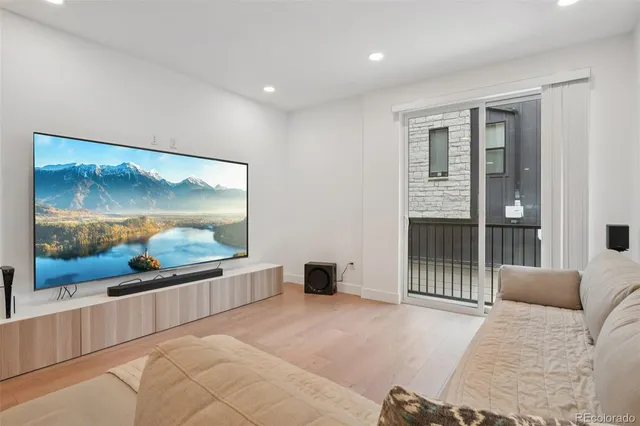 a bedroom with a bed and glass wall painting