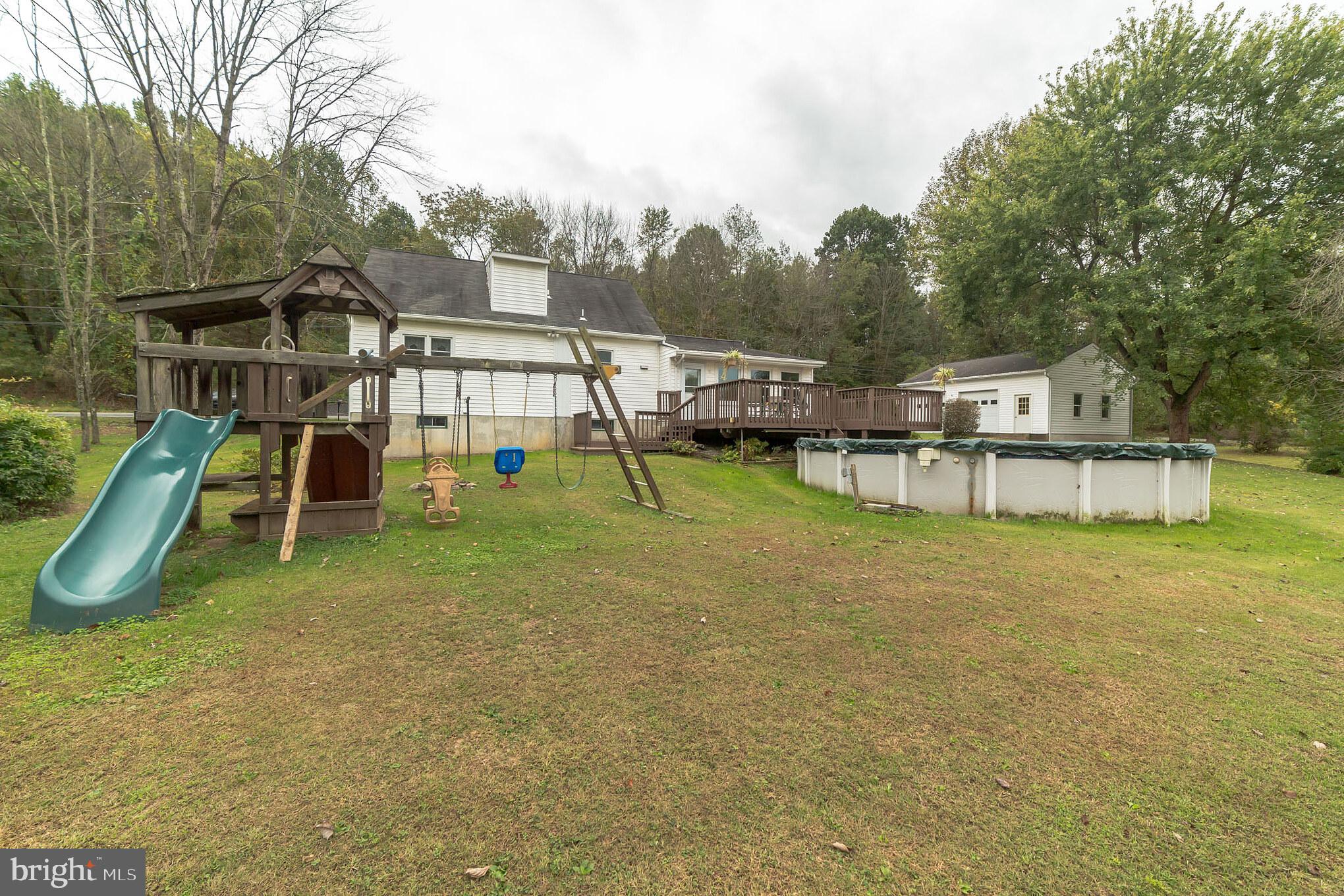 8865 Mountain Road Alburtis, PA 18011 - Photo 16 of 27 Pool, Swing set