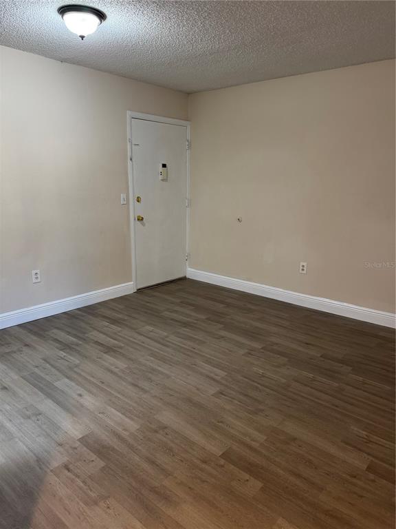 948 Lake Destiny Road, Unit C Altamonte Springs, FL 32714 - Photo 4 of 6 a view of an empty room with wooden floor