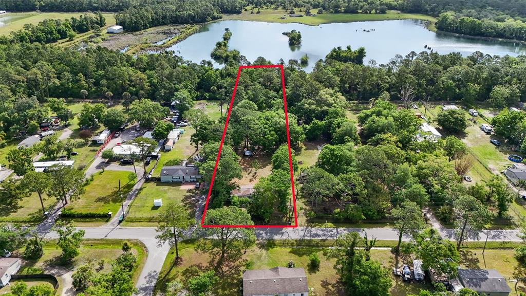 1263 St Nicholas Avenue Christmas, FL 32709 - Photo 2 of 5 an aerial view of house with yard and swimming pool