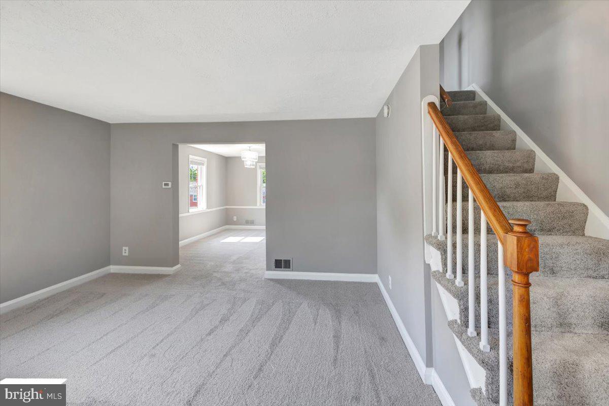 1811 Trenleigh Road Parkville, MD 21234 - Photo 6 of 35 Main level living room - hardwoods under carpet
