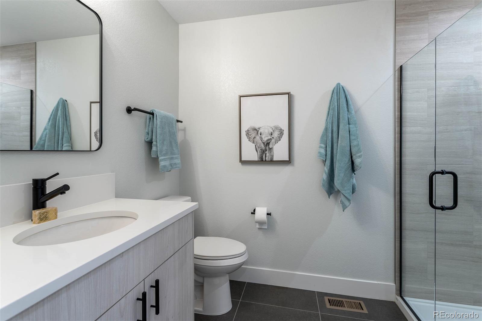 2360 West 49th Avenue Denver, CO 80221 - Photo 15 of 25 a bathroom with a sink and toilet