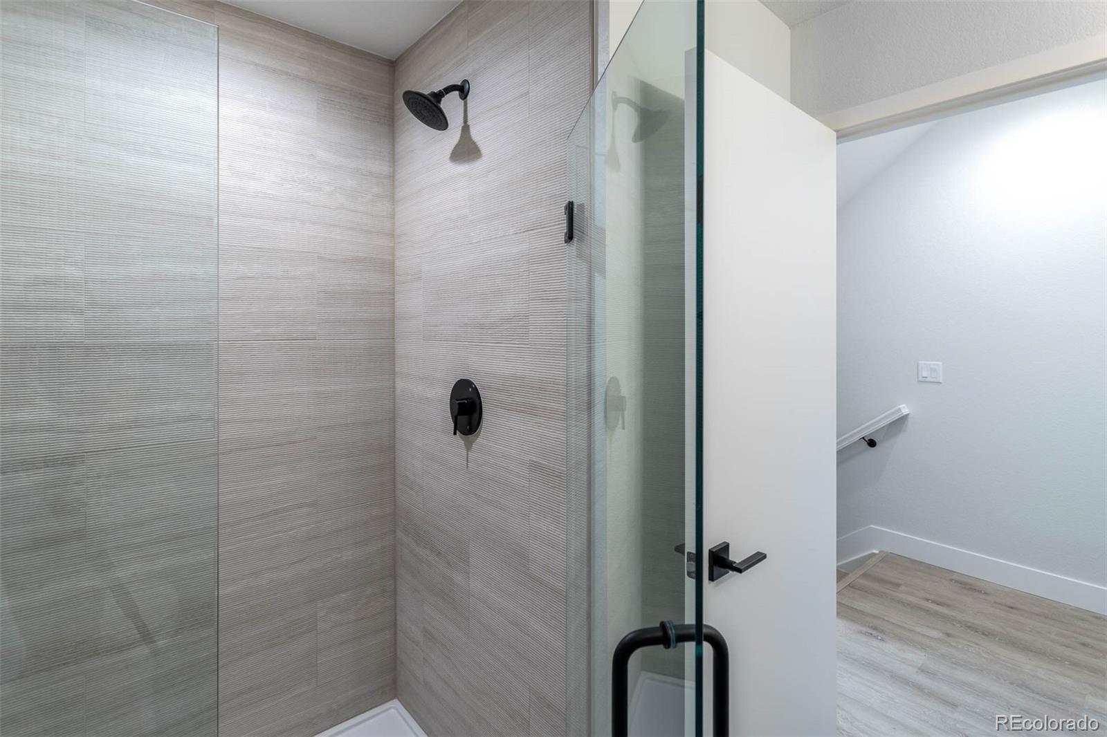 2360 West 49th Avenue Denver, CO 80221 - Photo 16 of 25 a bathroom with a shower