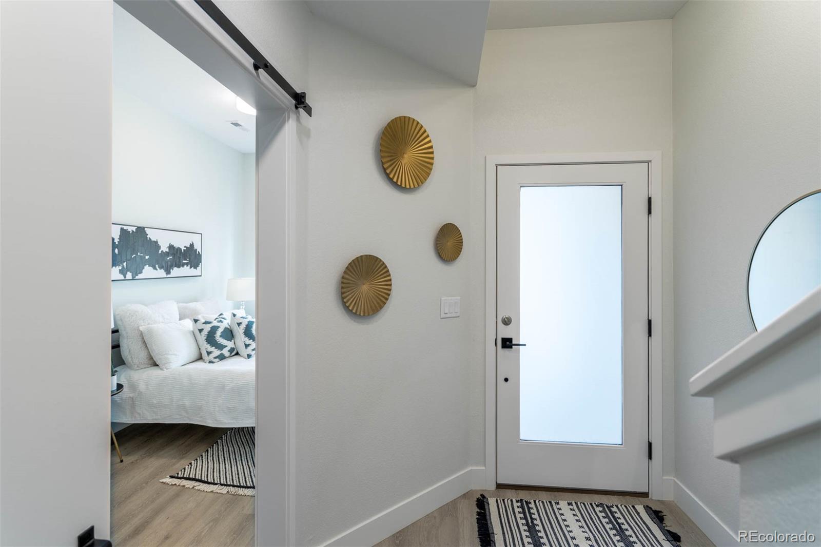 2360 West 49th Avenue Denver, CO 80221 - Photo 20 of 25 a bedroom with a bed and a window