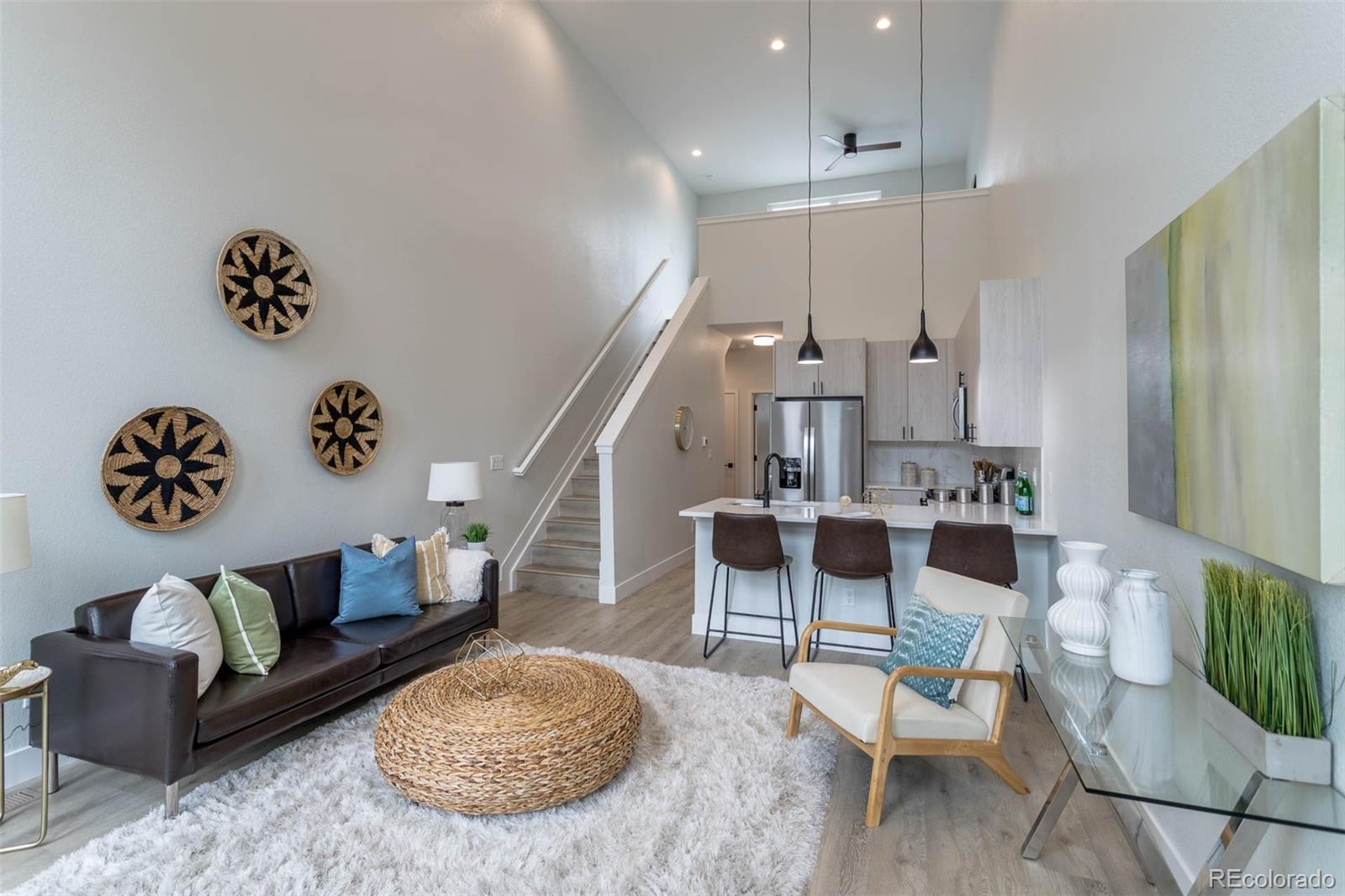 2360 West 49th Avenue Denver, CO 80221 - Photo 3 of 25 a living room with furniture and a rug