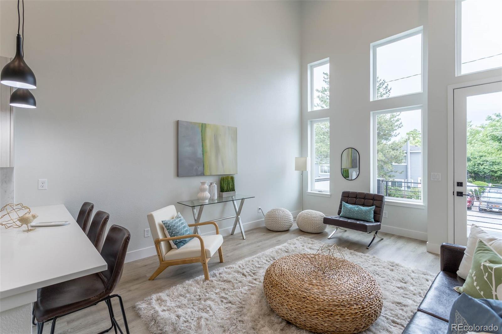 2360 West 49th Avenue Denver, CO 80221 - Photo 5 of 25 a living room with furniture and a large window
