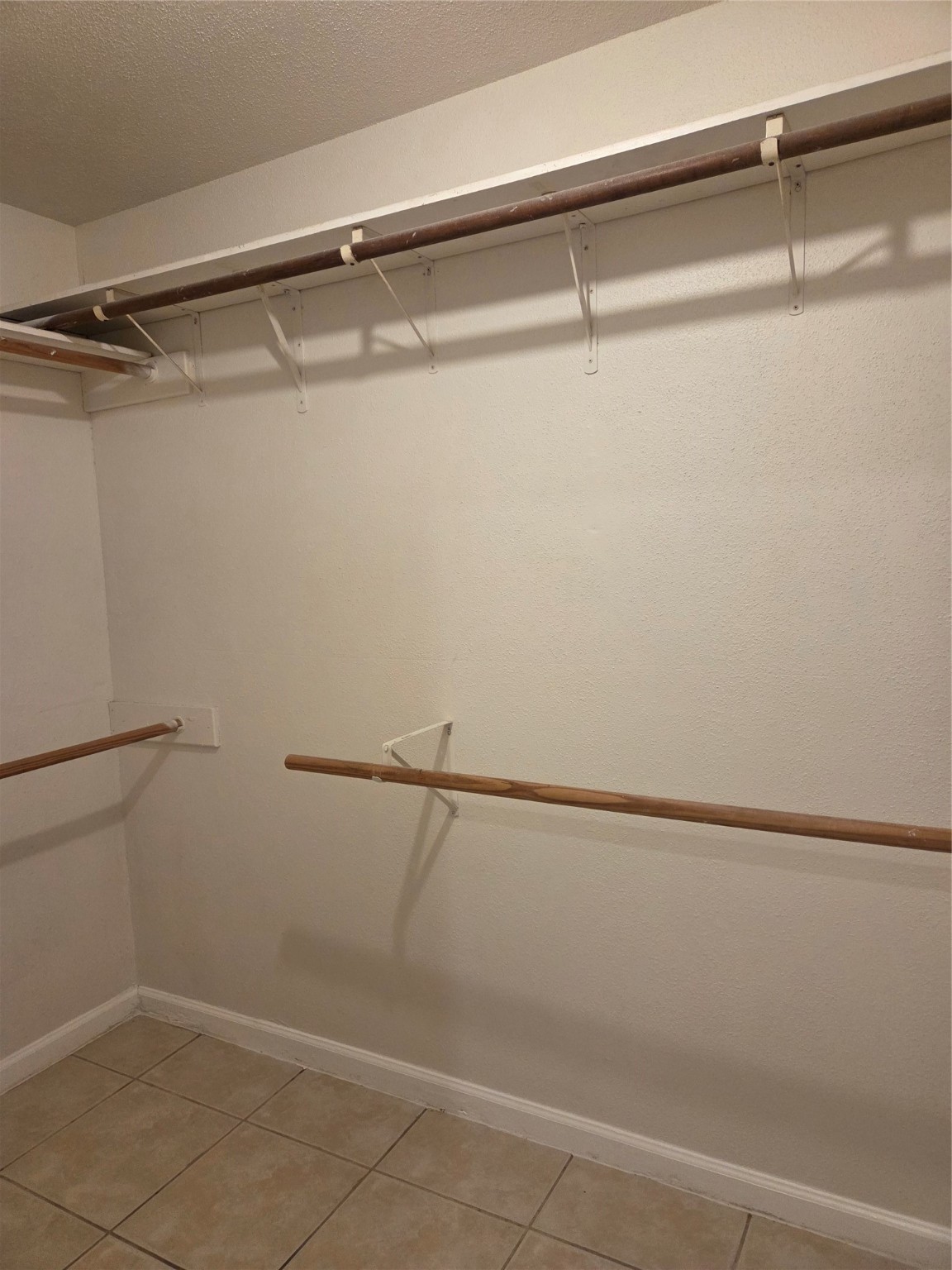 12319 Ridgeside Drive Houston, TX 77072 - Photo 15 of 22 a view of a room with racks on the wall