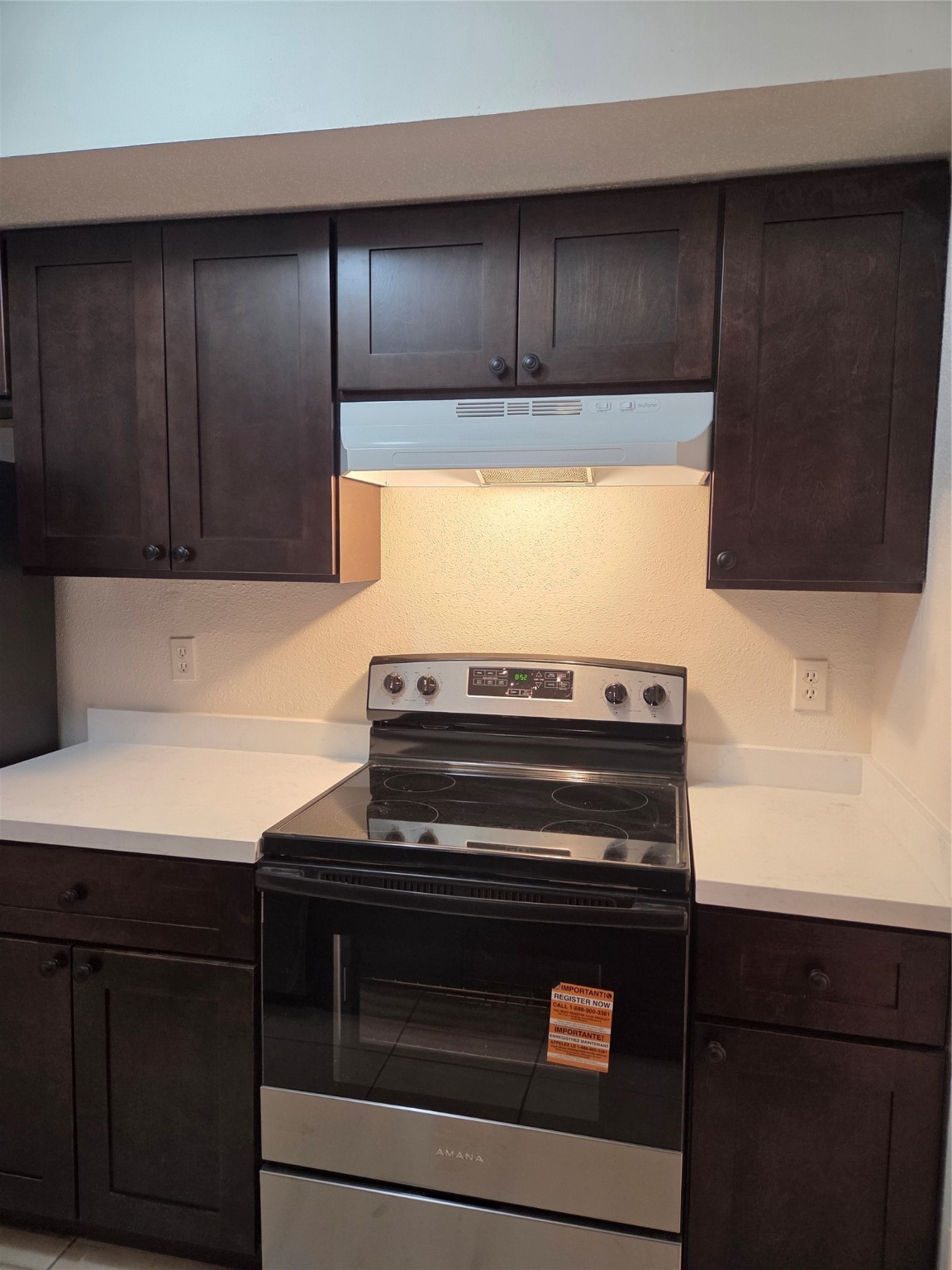 12319 Ridgeside Drive Houston, TX 77072 - Photo 7 of 22 a stove top oven sitting inside of a kitchen