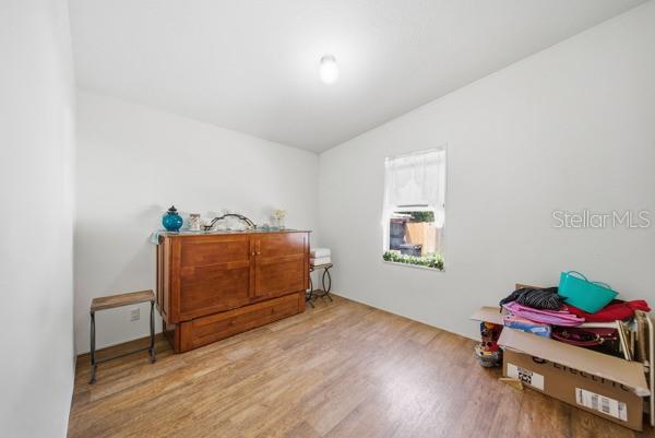 12148 Rutherford Lane Hudson, FL 34669 - Photo 16 of 30 a room with toys and dresser