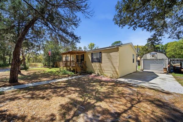 12148 Rutherford Lane Hudson, FL 34669 - Photo 2 of 30 a view of a house with a yard