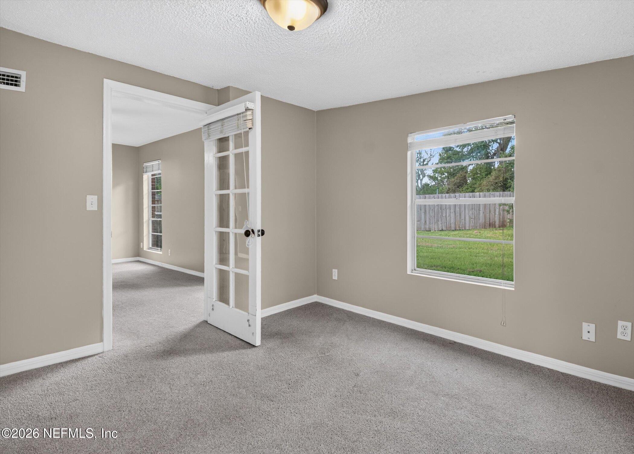 2705 Navajo Road Orange Park, FL 32073 - Photo 34 of 58 an empty room with windows