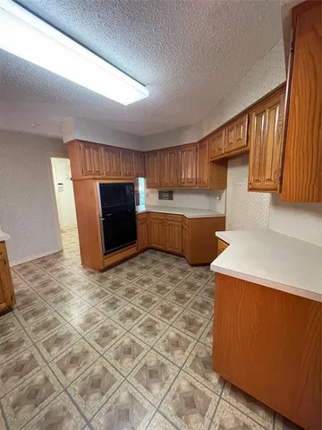 a kitchen with a cabinets and window