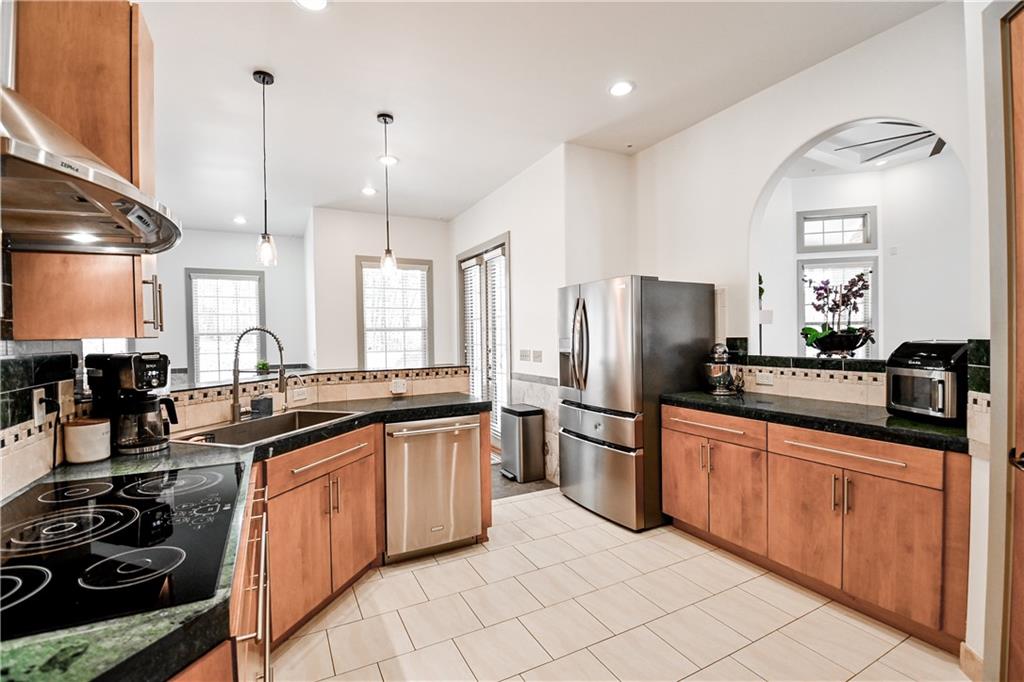 412 Trillium Trail Pendergrass, GA 30567 - Photo 12 of 49 a kitchen with stainless steel appliances a sink stove and refrigerator