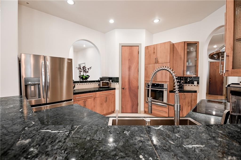412 Trillium Trail Pendergrass, GA 30567 - Photo 15 of 49 a kitchen with stainless steel appliances a refrigerator and microwave