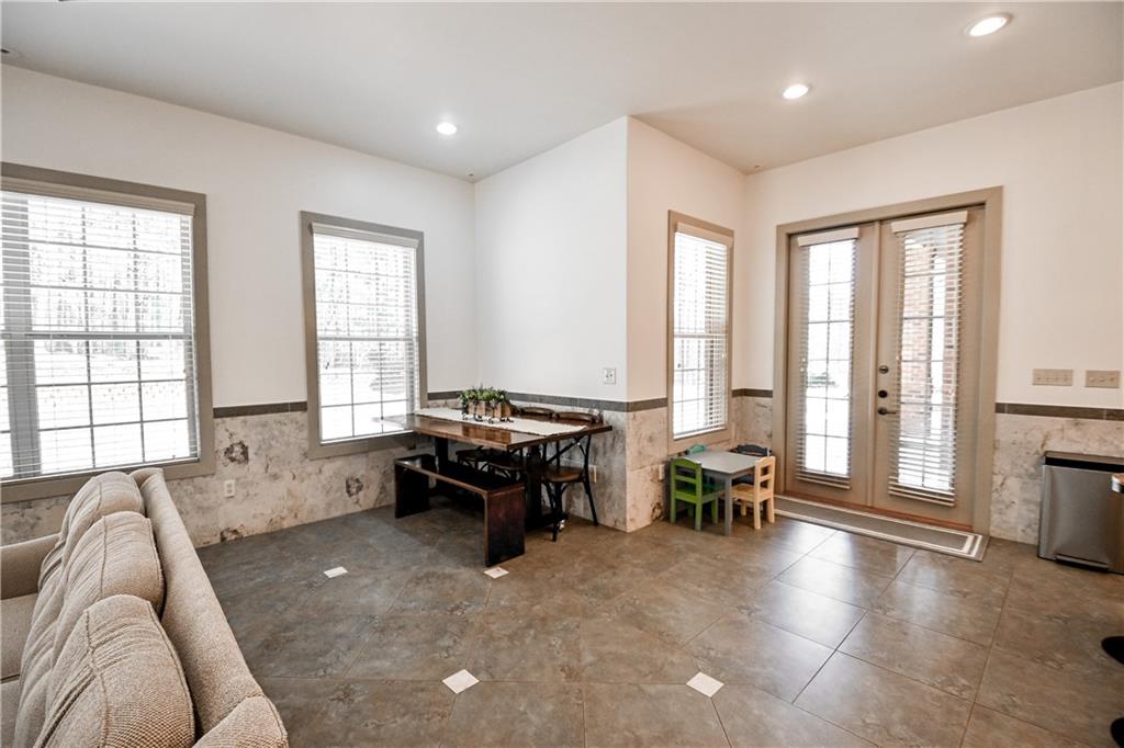 412 Trillium Trail Pendergrass, GA 30567 - Photo 18 of 49 a living room with furniture and floor to ceiling windows