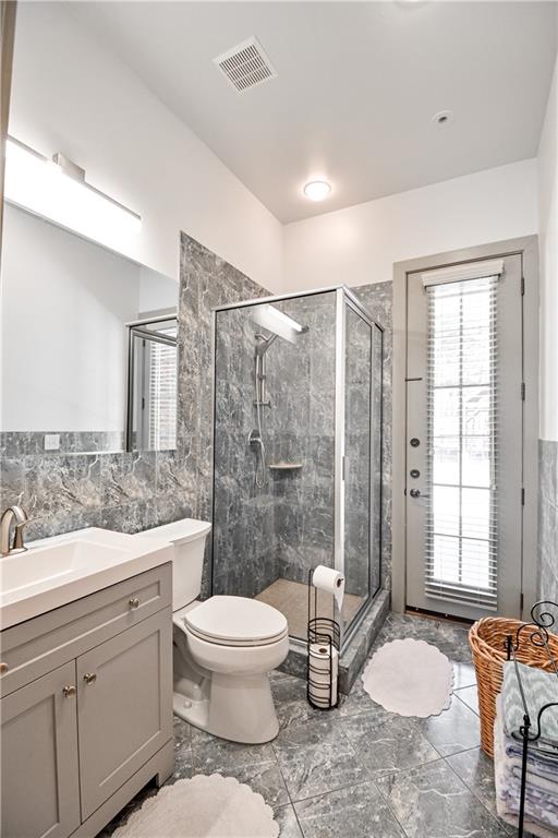 412 Trillium Trail Pendergrass, GA 30567 - Photo 21 of 49 a bathroom with a toilet a sink a mirror a window and shower