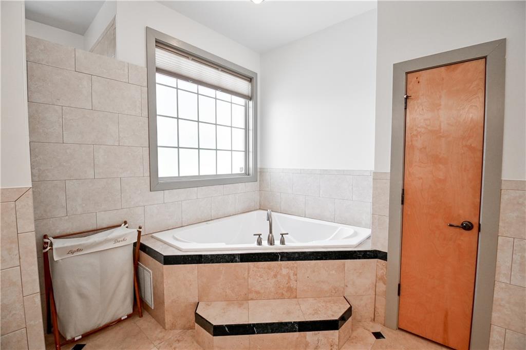 412 Trillium Trail Pendergrass, GA 30567 - Photo 21 of 37 a bathroom with a bathtub and a sink