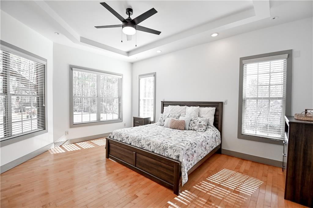 412 Trillium Trail Pendergrass, GA 30567 - Photo 22 of 49 a bedroom with a large bed and a large window