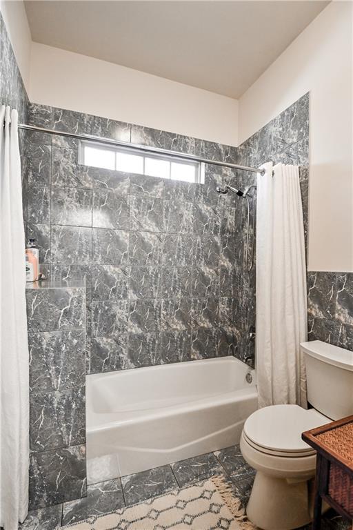 412 Trillium Trail Pendergrass, GA 30567 - Photo 25 of 37 a bathroom with a toilet and a bathtub