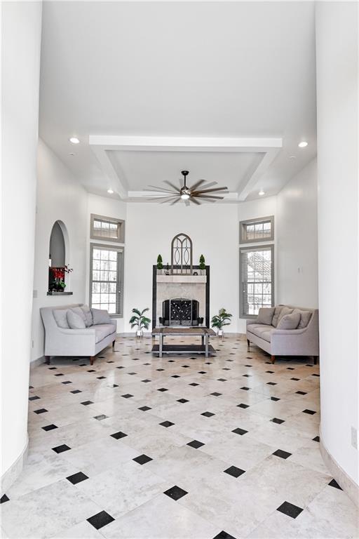 412 Trillium Trail Pendergrass, GA 30567 - Photo 5 of 49 a living room with furniture a fireplace and a flat screen tv