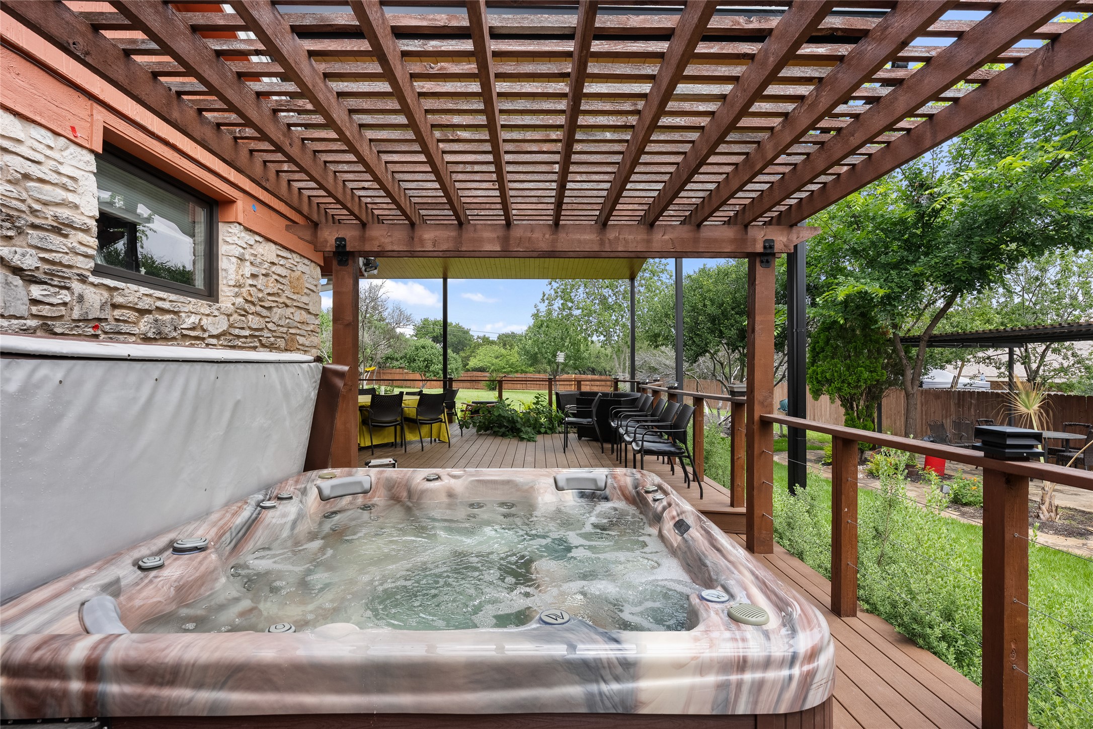 301 Oak Ridge Road Georgetown, TX 78628 - Photo 20 of 34 Outdoor spa situated on a wood-finish deck with a pergola overhead