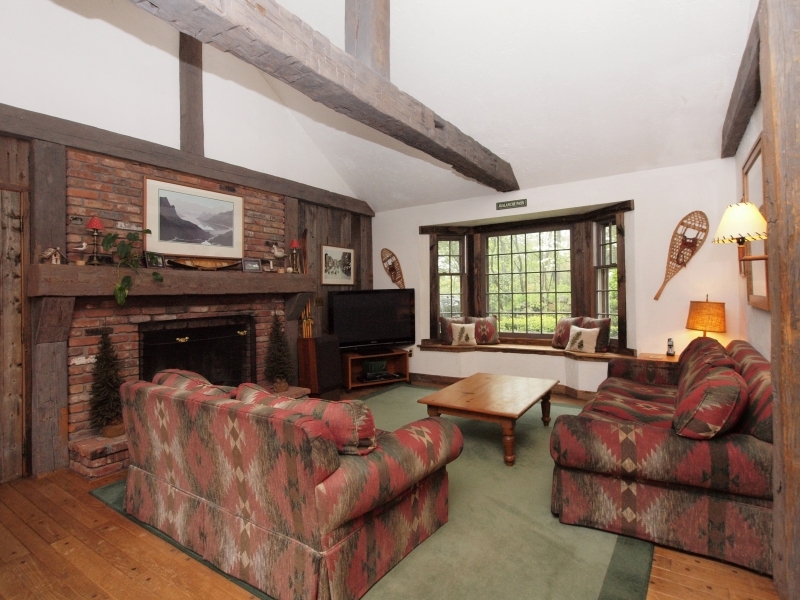 772 Ponus Ridge Road New Canaan, CT 06840 - Photo 11 of 19 a living room with furniture and a fireplace