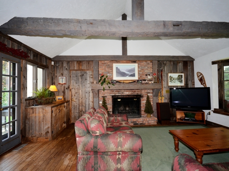 772 Ponus Ridge Road New Canaan, CT 06840 - Photo 12 of 19 a living room with furniture and a fireplace