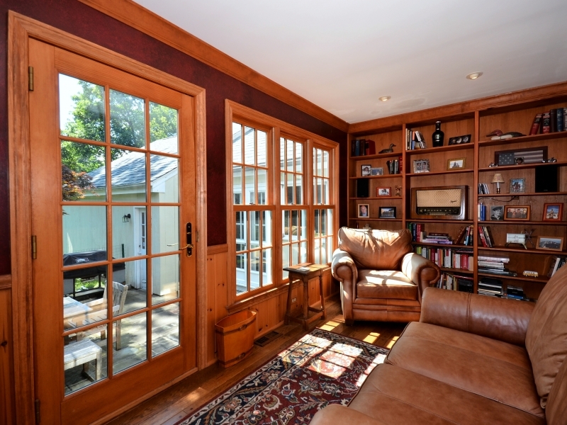 772 Ponus Ridge Road New Canaan, CT 06840 - Photo 13 of 19 a living room with furniture and a floor to ceiling window
