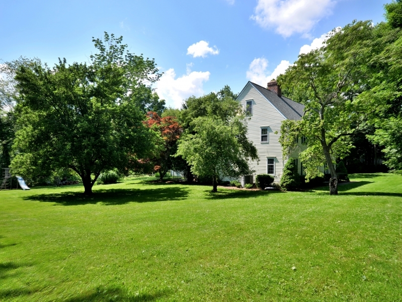 772 Ponus Ridge Road New Canaan, CT 06840 - Photo 17 of 19 a front view of a house with garden