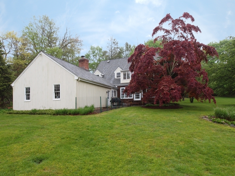 772 Ponus Ridge Road New Canaan, CT 06840 - Photo 2 of 19 a view of a house with a yard