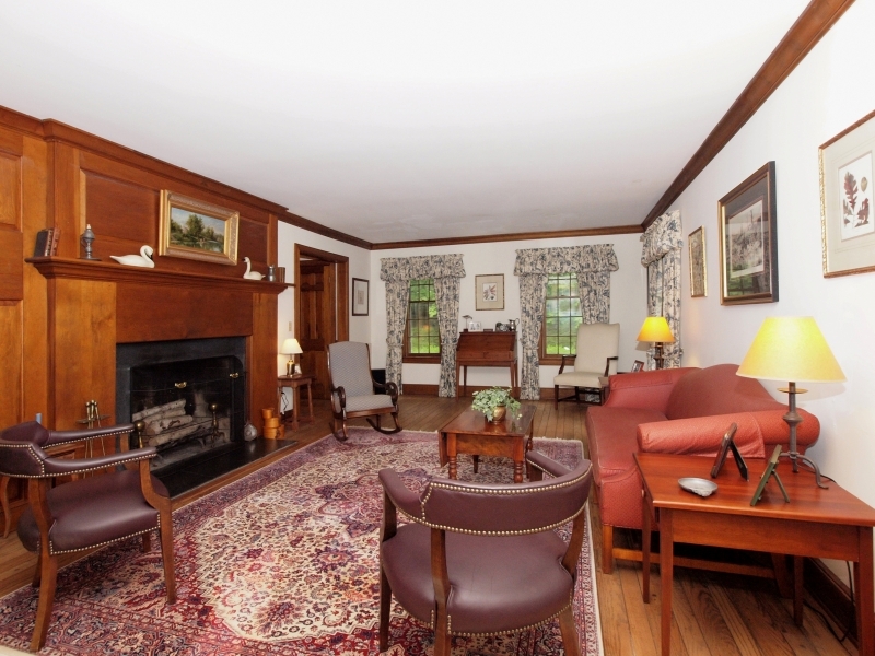 772 Ponus Ridge Road New Canaan, CT 06840 - Photo 5 of 19 a living room with furniture and a fireplace
