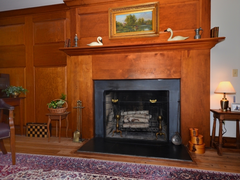 772 Ponus Ridge Road New Canaan, CT 06840 - Photo 7 of 19 a living room with furniture and a fireplace