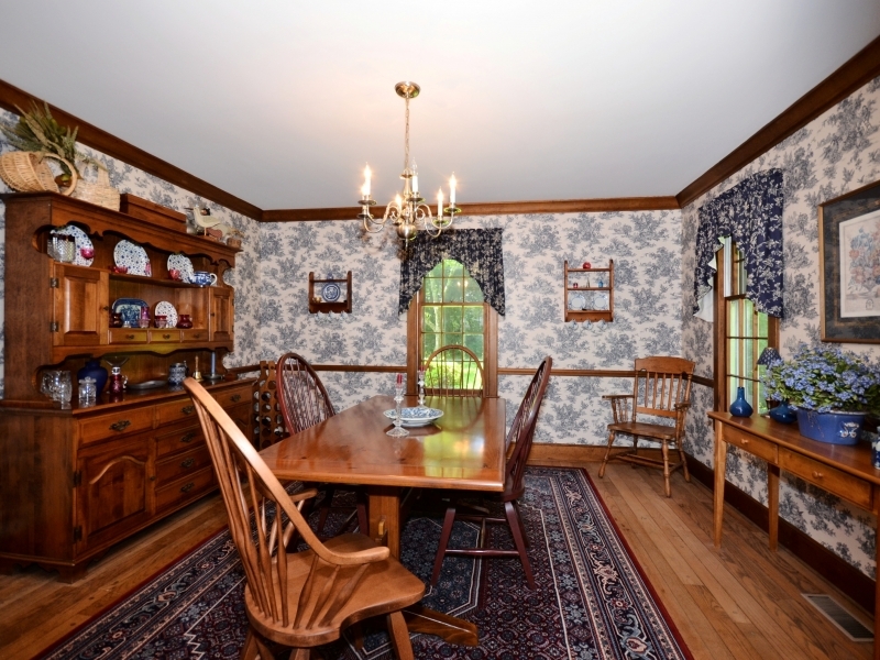 772 Ponus Ridge Road New Canaan, CT 06840 - Photo 8 of 19 a dining room with furniture and a floor to ceiling window