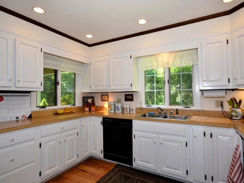 772 Ponus Ridge Road New Canaan, CT 06840 - Photo 10 of 19 a kitchen with sink a window and cabinets