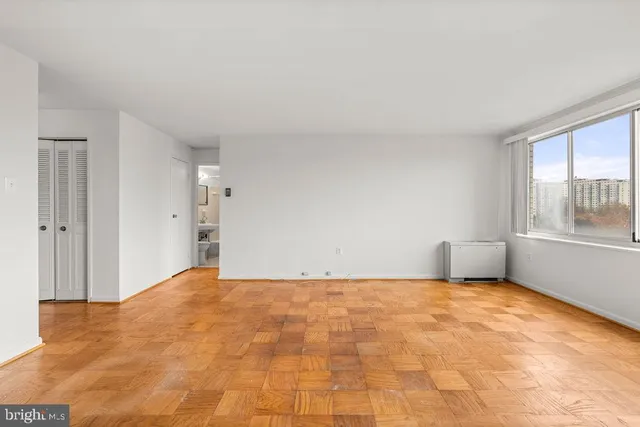 a view of an empty room with a window