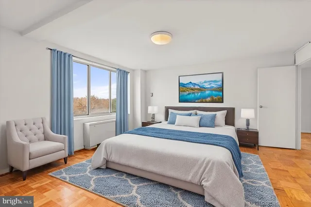 a bedroom with a bed and a couch