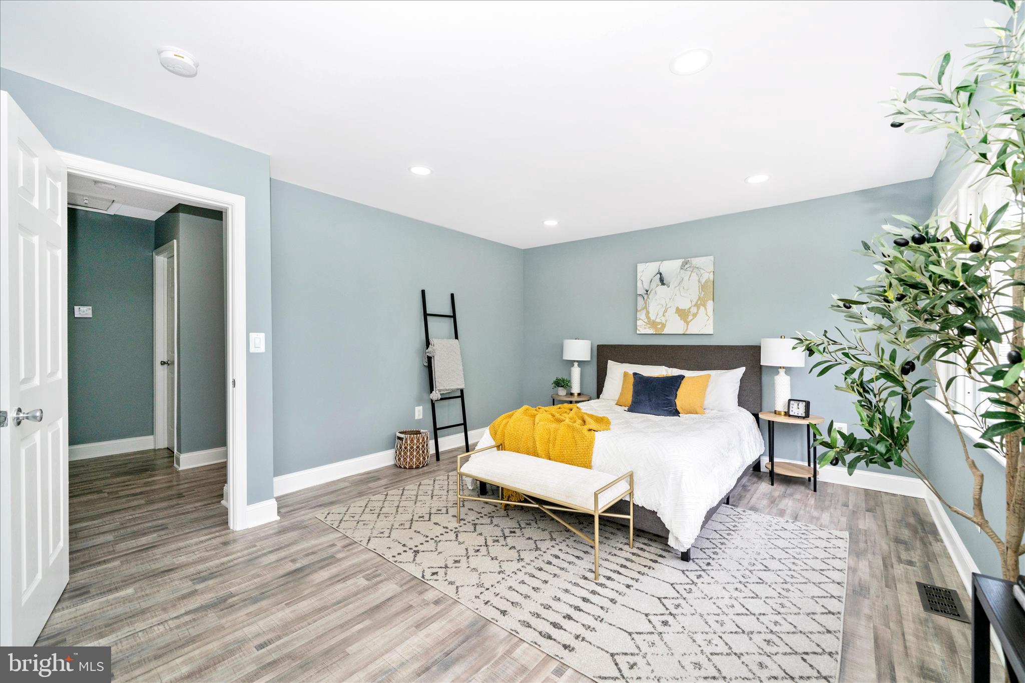 6737 Allentown Road Temple Hills, MD 20748 - Photo 33 of 51 a bed room with a bed and a chair