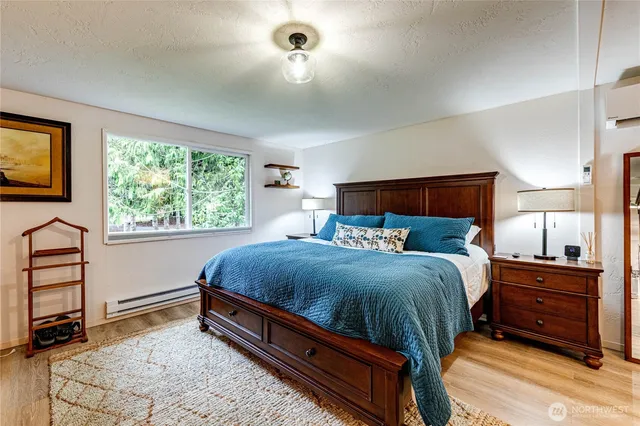 a bed room with a bed and window